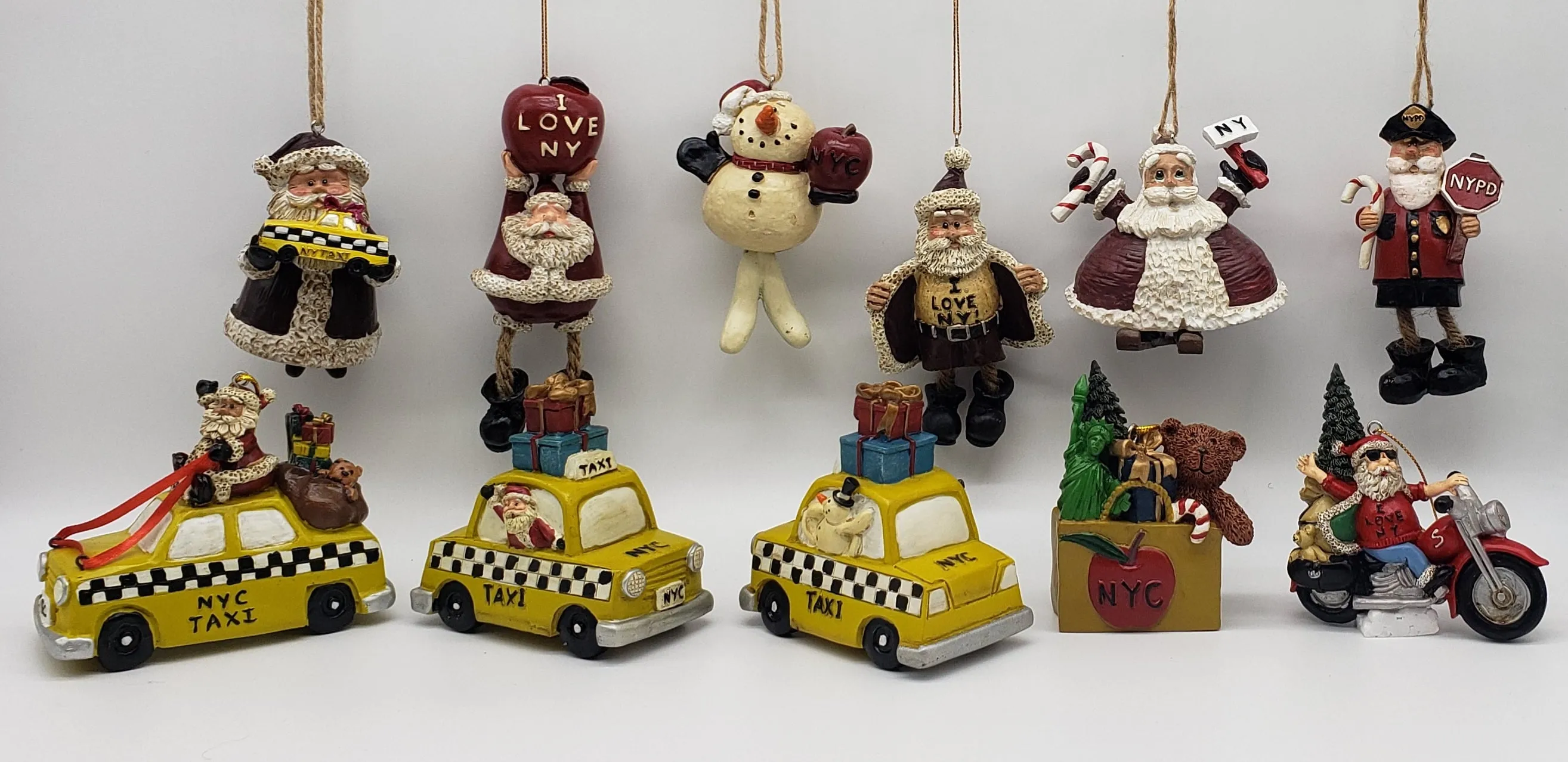 Santa holding a Yellow Cap NYC Taxi Christmas ornament