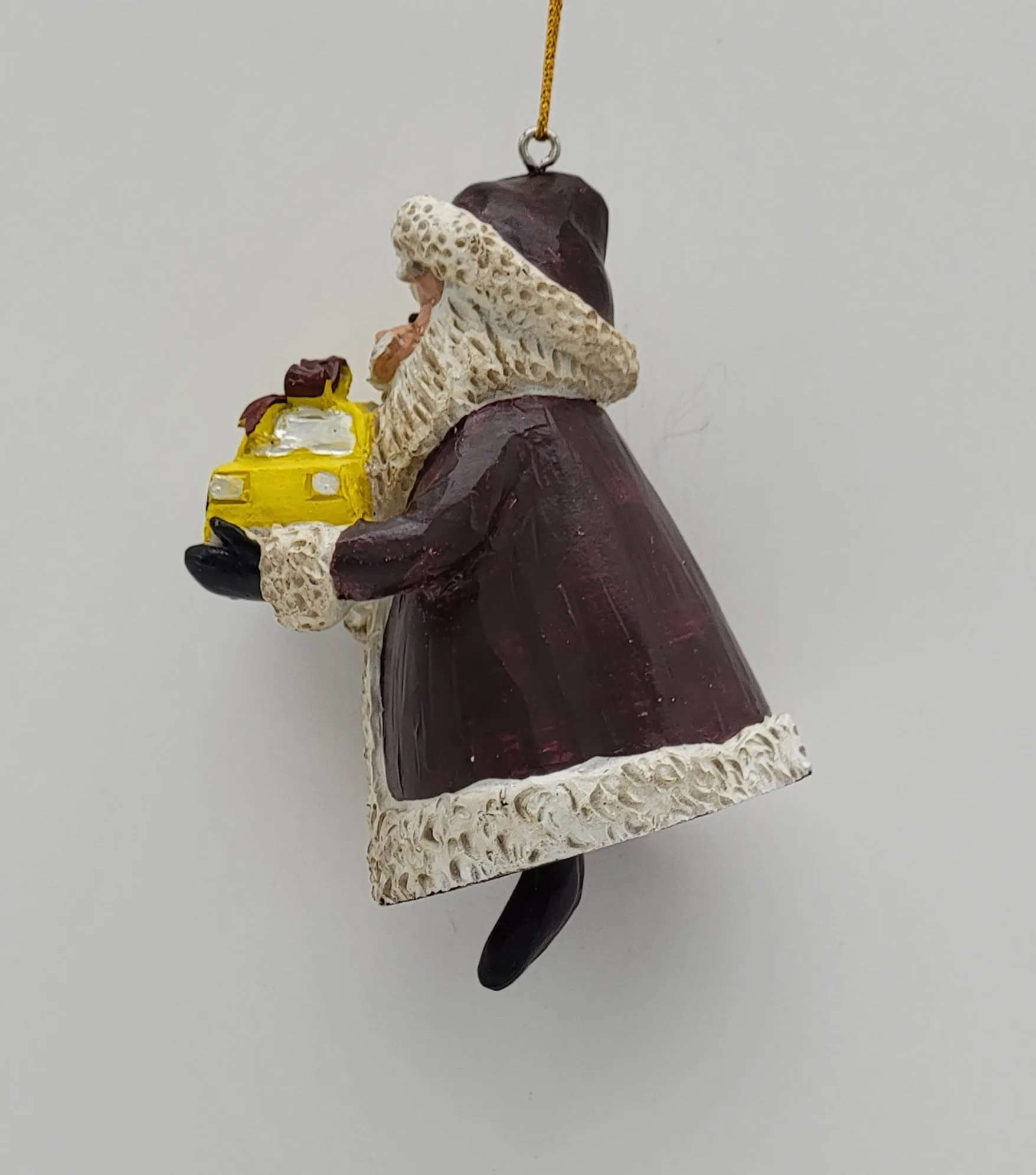 Santa holding a Yellow Cap NYC Taxi Christmas ornament