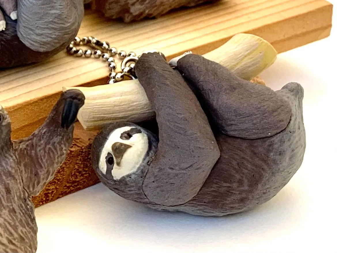 X 70839 SLOTH CHARM CAPSULE-DISCONTINUED