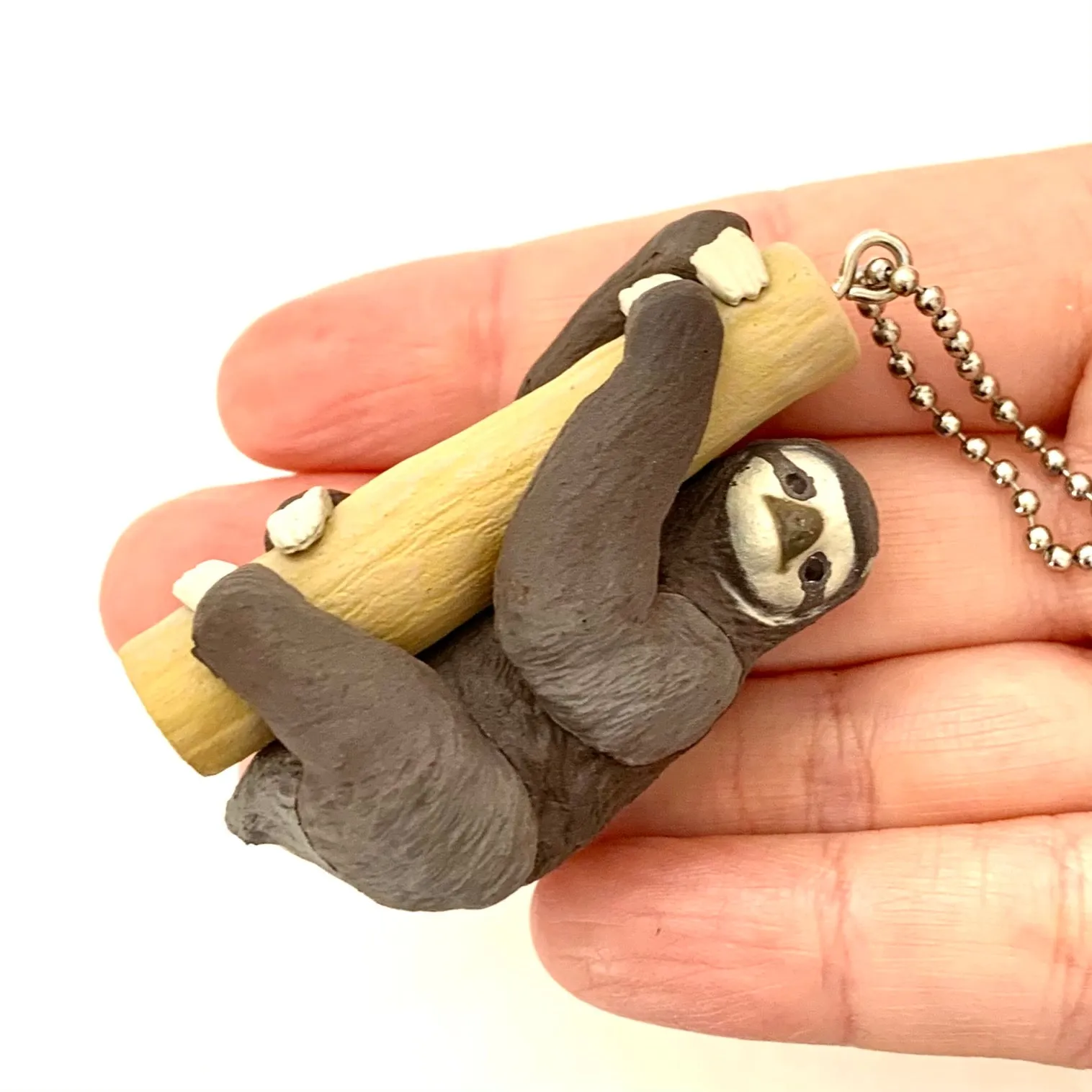 X 70839 SLOTH CHARM CAPSULE-DISCONTINUED