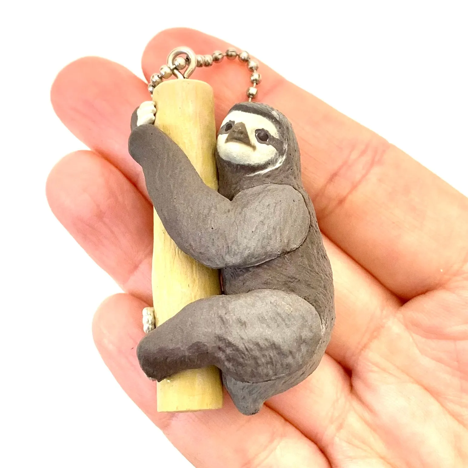 X 70839 SLOTH CHARM CAPSULE-DISCONTINUED