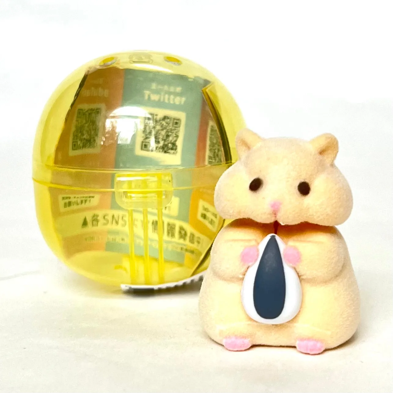 X 70973 Hamster with Seed Figurine Capsule-DISCONTINUED