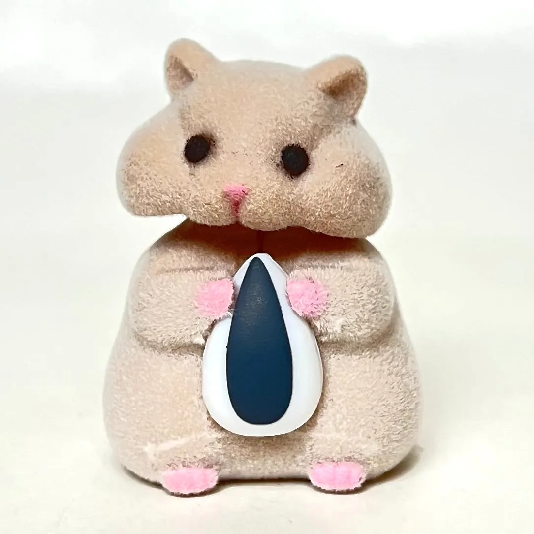 X 70973 Hamster with Seed Figurine Capsule-DISCONTINUED