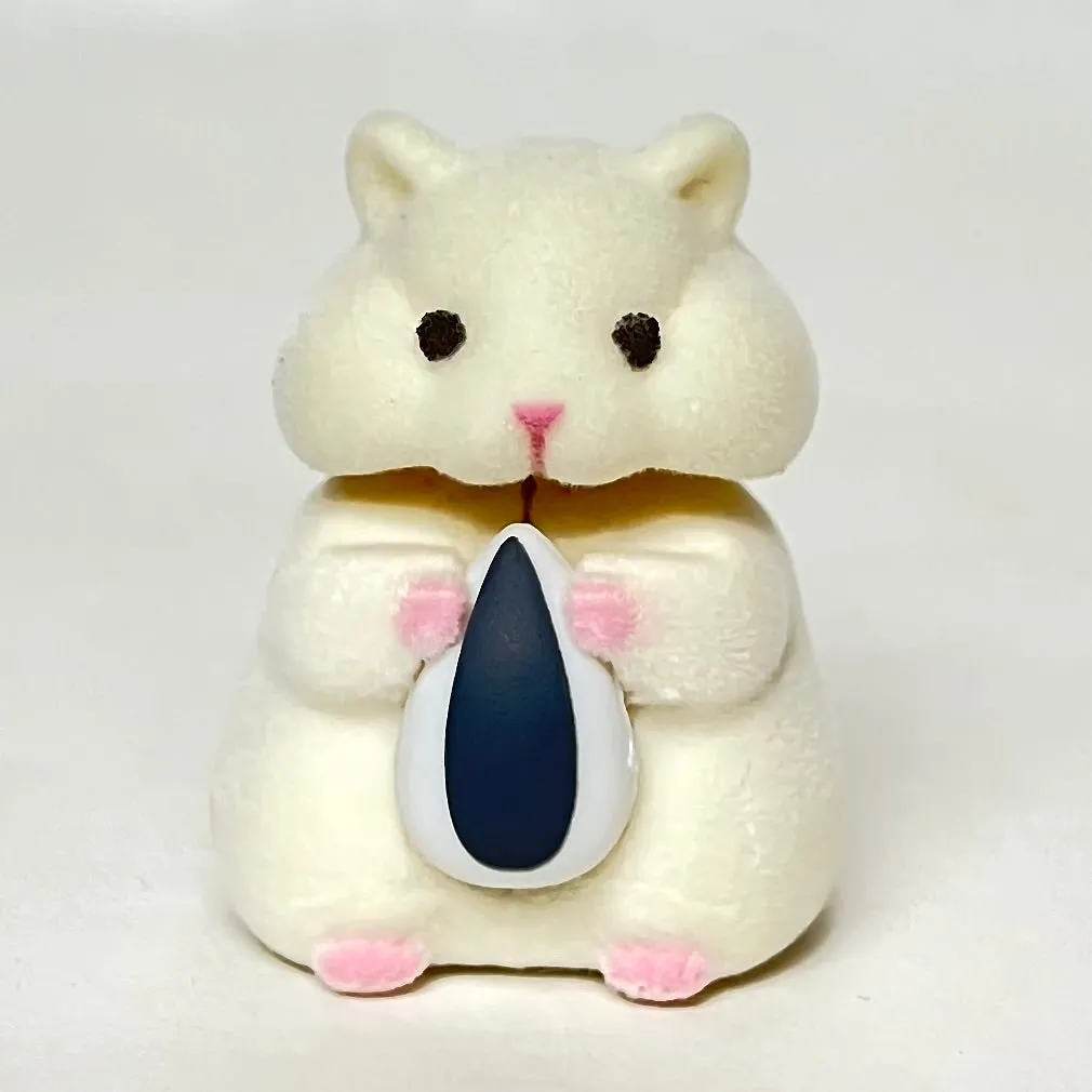 X 70973 Hamster with Seed Figurine Capsule-DISCONTINUED