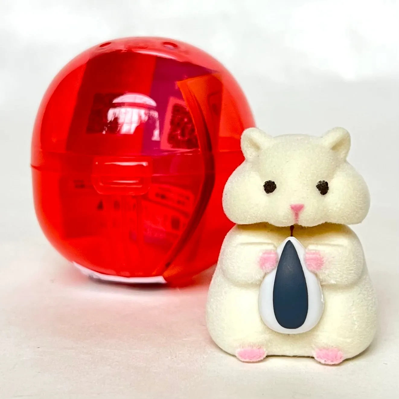 X 70973 Hamster with Seed Figurine Capsule-DISCONTINUED