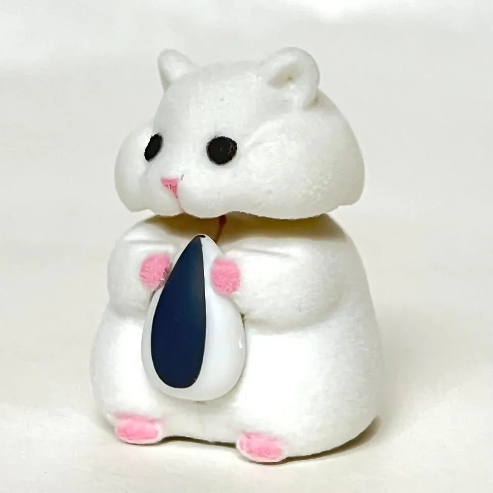 X 70973 Hamster with Seed Figurine Capsule-DISCONTINUED