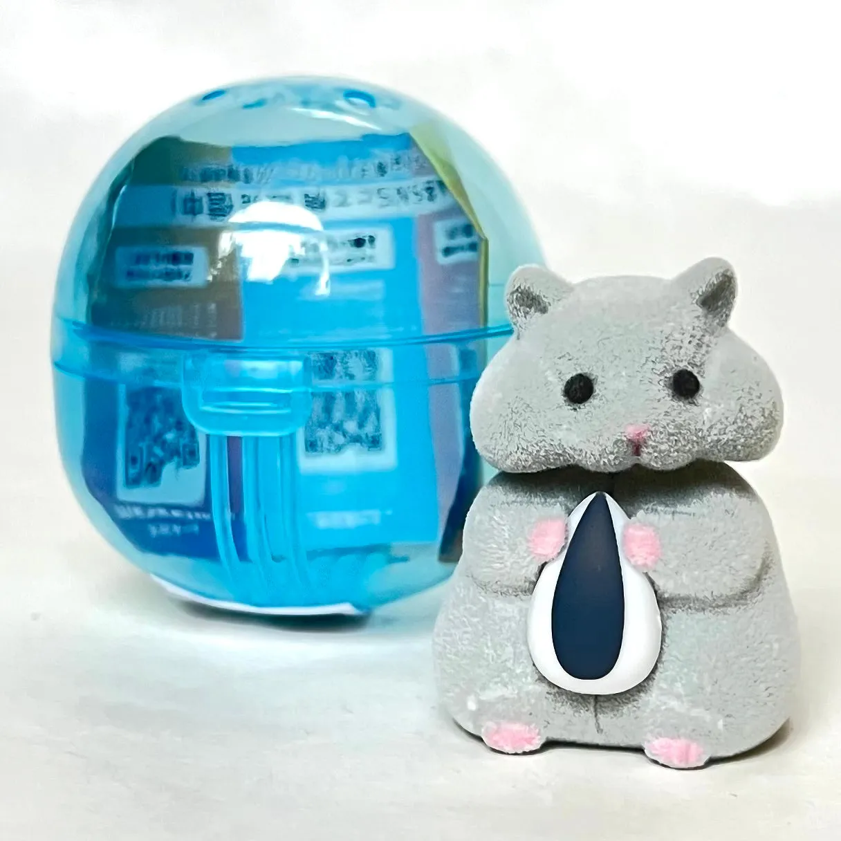 X 70973 Hamster with Seed Figurine Capsule-DISCONTINUED