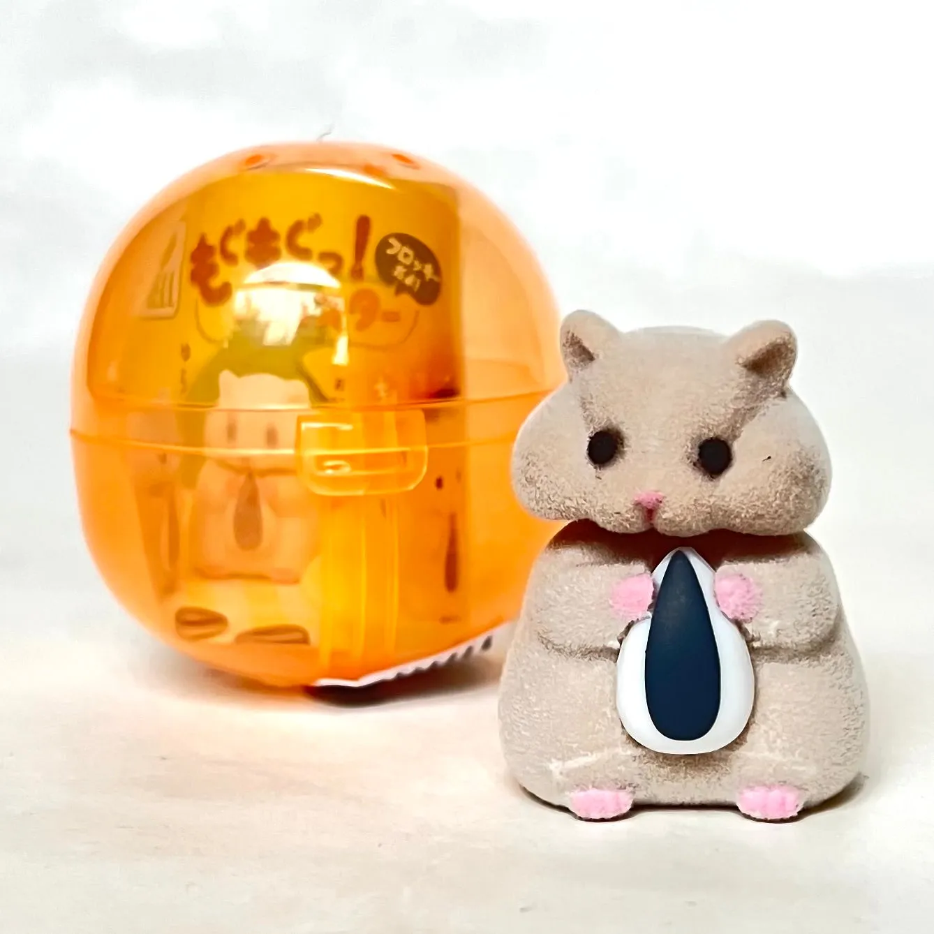 X 70973 Hamster with Seed Figurine Capsule-DISCONTINUED