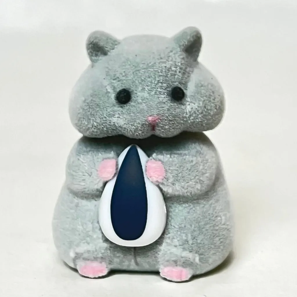 X 70973 Hamster with Seed Figurine Capsule-DISCONTINUED